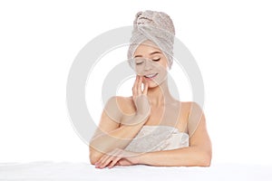 Portrait of young pretty woman with towels