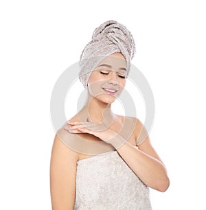 Portrait of young pretty woman with towels