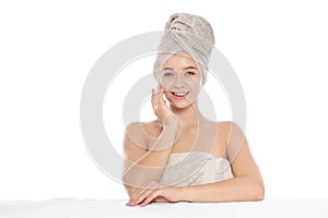 Portrait of young pretty woman with towels