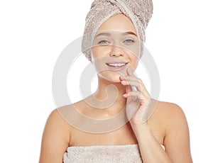 Portrait of young pretty woman with towels