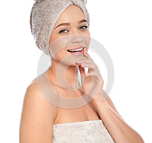 Portrait of young pretty woman with towels