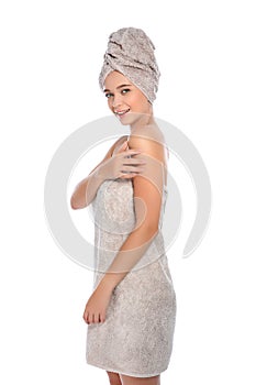 Portrait of young pretty woman with towels