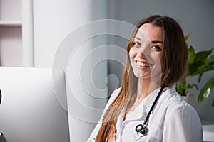 Portrait of a Young professional female doctor smiling at clinic