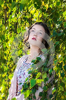 Portrait young sad girl in park