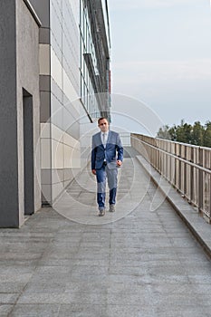 Portrait of a young serious smiling businessman