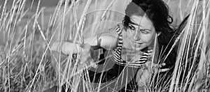 Portrait of young sexy girl in the grass