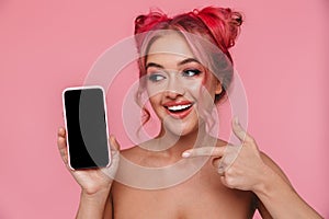 Portrait of young shirtless young woman pointing finger at smartphone