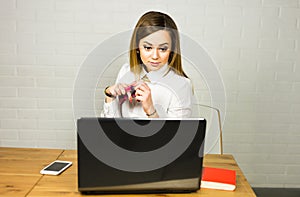 Portrait young shocked business woman sitting in front of laptop computer looking at screen. Funny face expression