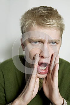 Portrait of young shouting man