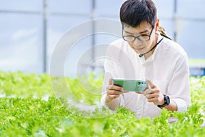 Portrait of young smart farmer using digital tablet computer for inspecting. using technology in agriculture field application in