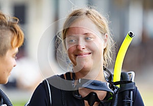 Portrait of young smile girl diver with diving equipment.