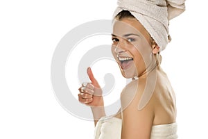 Portrait of young smiling beautiful woman with towel on her head