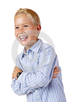 Portrait of young smiling boy with crossed arms photo