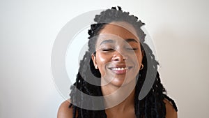 Portrait of young smiling female African American laughs cheerfully.