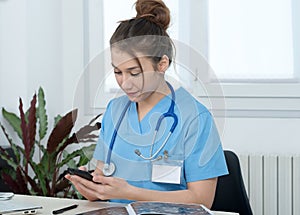 Portrait of young and smiling female doctor