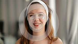 Portrait of Young Smiling Girl With Patches On The Face Under Eyes. Makeup and Beauty Treatments Concept. Skin Care, Spa