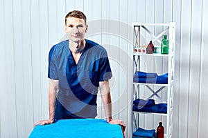 Doctor masseur in his office photo