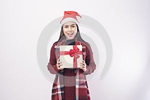 Portrait of young smiling woman wearing red Santa Claus hat isolated white background studio