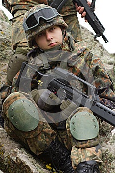 Portrait of young soldiers in helmet