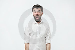 Portrait of young spanish man looking furious.