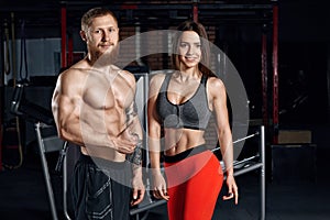 Portrait of a young sport couple in the gym.