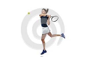 Portrait of young sportive woman, tennis player playing tennis isolated on white background. Healthy lifestyle, fitness