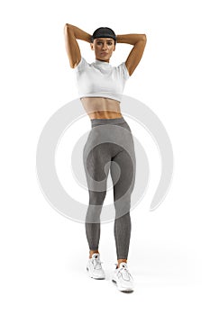 Portrait of young sporty happy woman with perfect body, abs, two arms behind the head