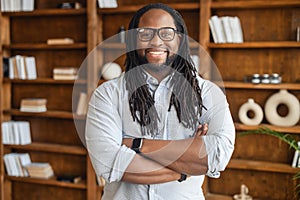 Portrait of a young stout african unshaven man with dreadlocks