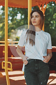 Portrait young student girl relaxing on a sunny day dreaming