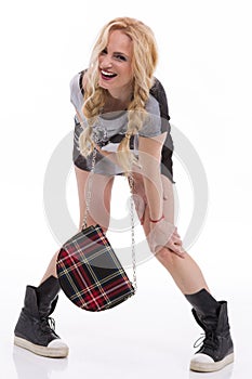 Portrait of young stunning woman in black minidress