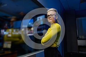 Portrait of young and successful female datacenter worker looking at camera