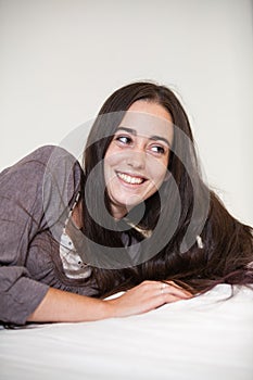 Portrait of a young and sweet natural woman without makeup with long brown hair