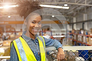 Portrait young teen African black girl teen work in large warehouse factory stock happy smiling