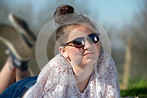 Portrait of a young teen girl with  sunglasses outdoor