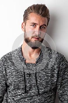 Portrait of a young thoughtful man, isolated on a white background