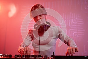 Portrait of young woman as female DJ