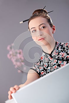 Portrait of young woman in asian outfit