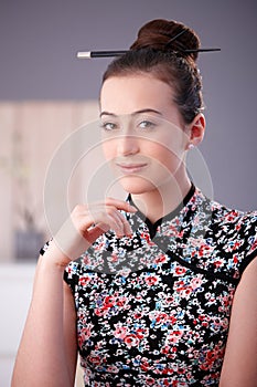 Portrait of young woman in asian outfit