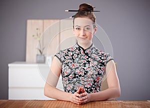 Portrait of young woman in asian outfit