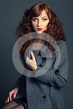 Portrait of young woman in autumn coat