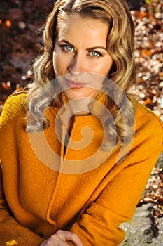 Portrait of young woman in autumn coat