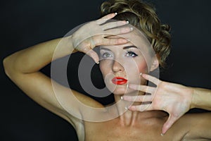 Portrait of a young woman with bare shoulders and