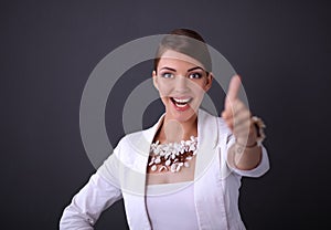 Portrait of young woman with beads showing ok