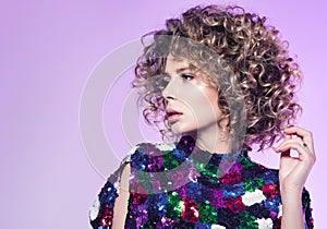 Portrait of young woman with beautiful curly hair