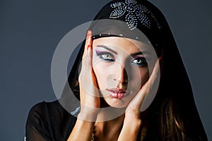 Portrait of the young woman in black tunic Arabic