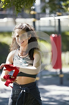 Portrait of young woman - box spotsman in summer park during work out training