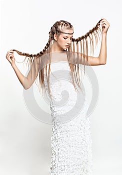 Portrait of young woman with braid hairdo