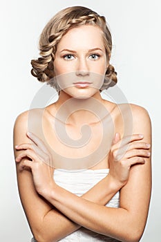 Portrait of young woman with braid hairdo