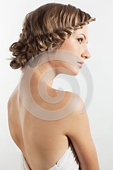 Portrait of young woman with braid hairdo