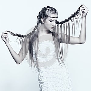 Portrait of young woman with braid hairdo